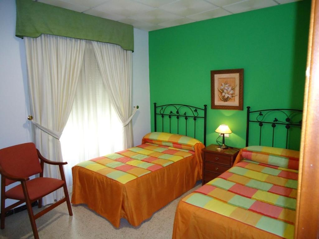 Hostal Los Claveles Баэна Номер фото